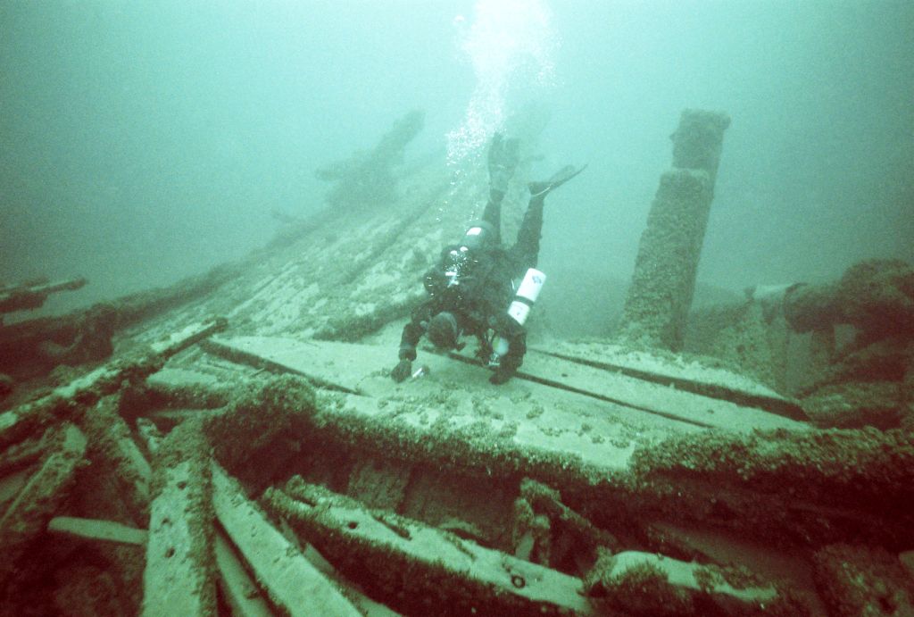 Diver Craig Rich explores the Ironsides' stern area