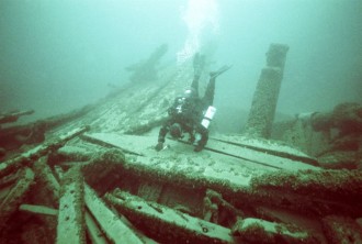 Diver Craig Rich explores the Ironsides' stern area